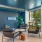room with seating and a table and a neon sign